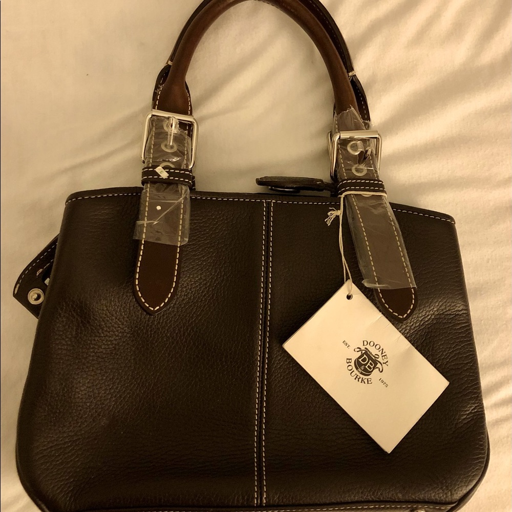 Dooney & Bourke brown buckle satchel.